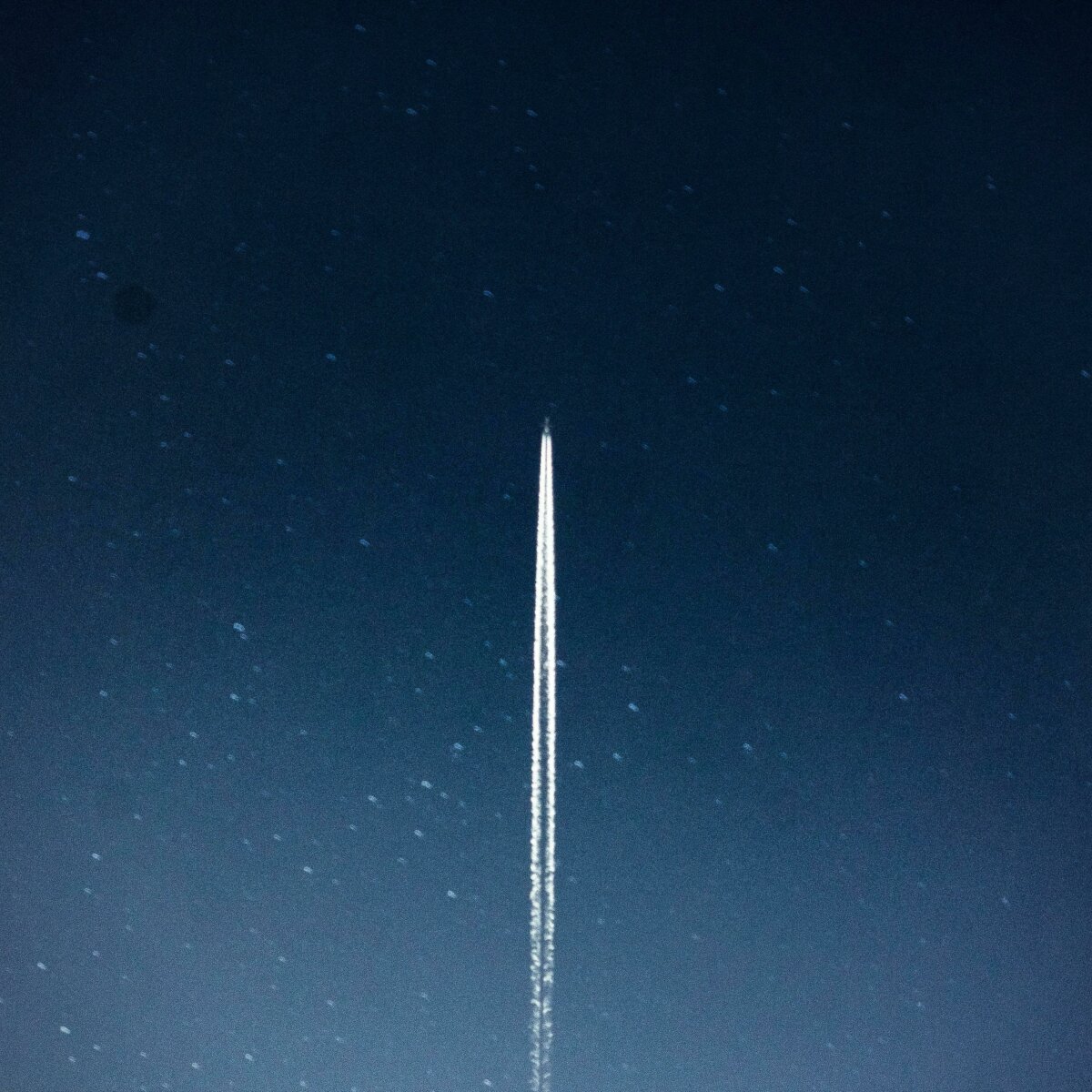 Trails from a space launch in the night sky