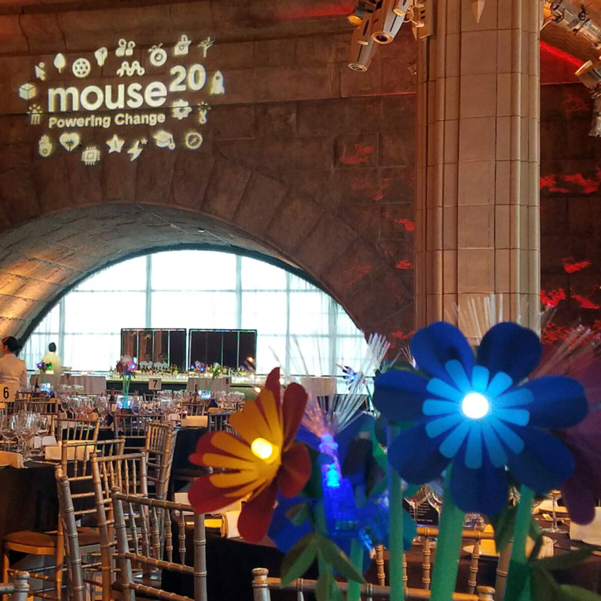 Tables with led flowers as centerpieces for youth focused technology nonprofit gala