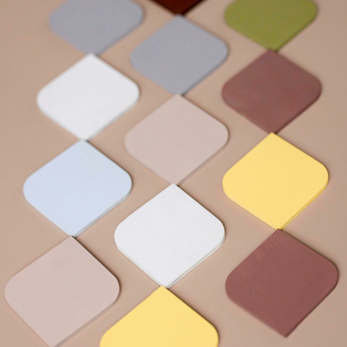 A collection of color tiles spread out on a table.