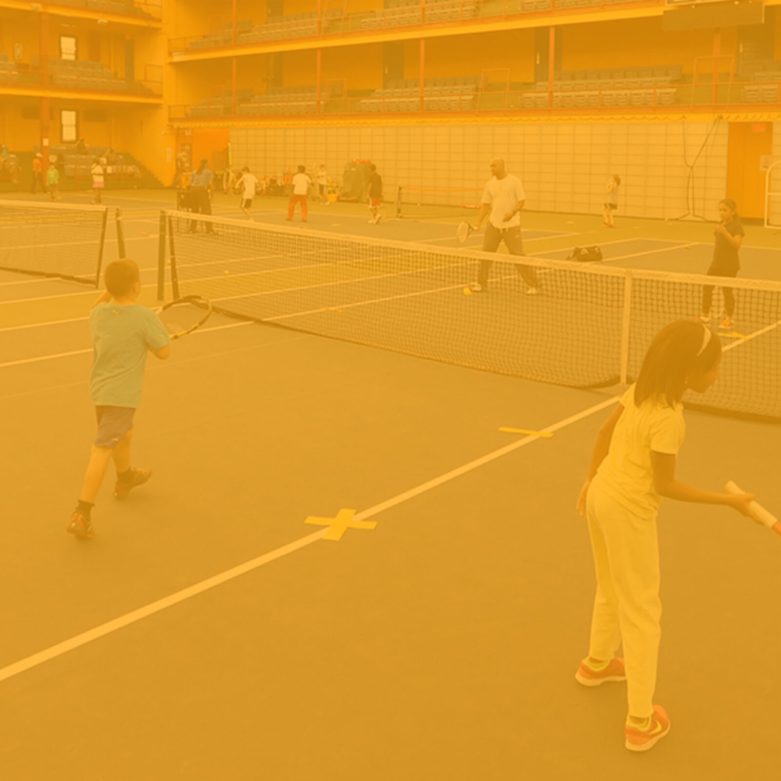 HJTEP brand and website image with youth practicing on tennis court